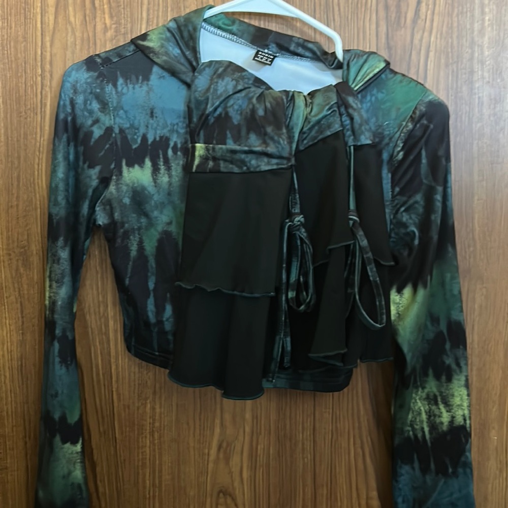 A 2pc set with a skirt and long sleeve cropped sweater